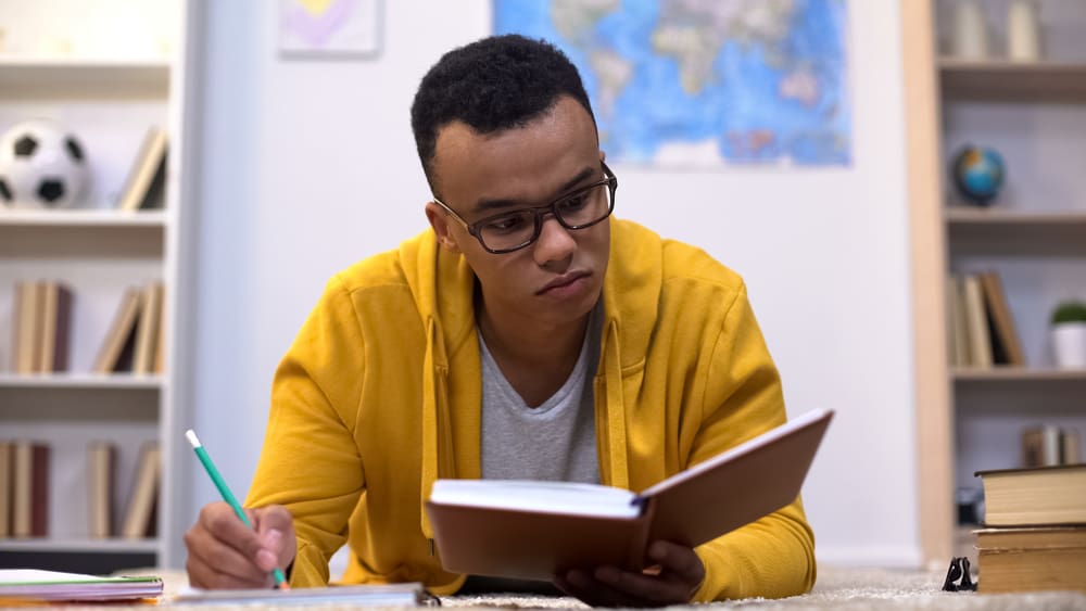 student writing college essay